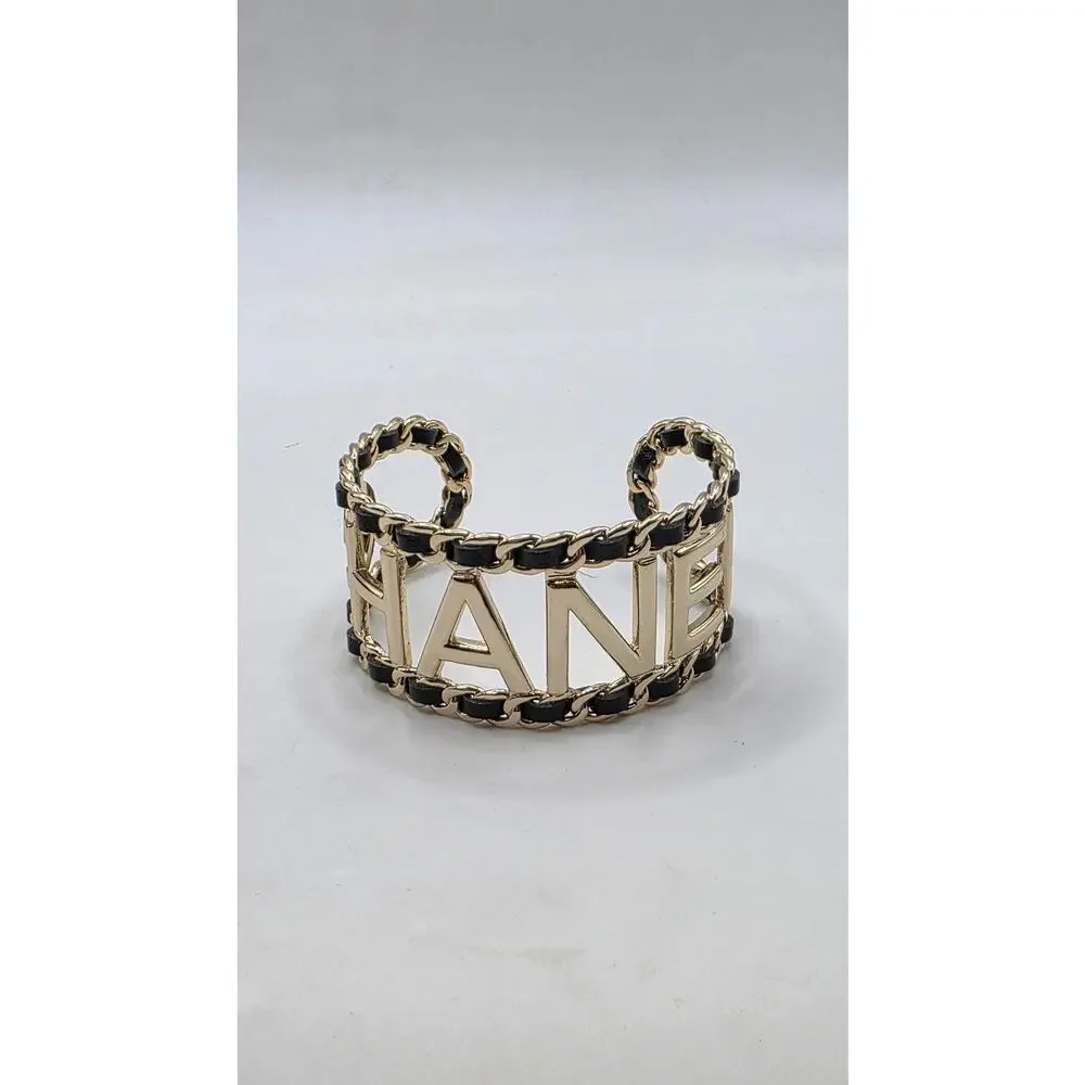 Chanel Gold-tone Leather 'CHANEL' Cuff Bracelet